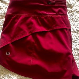 Lululemon running shorts red, size 10.